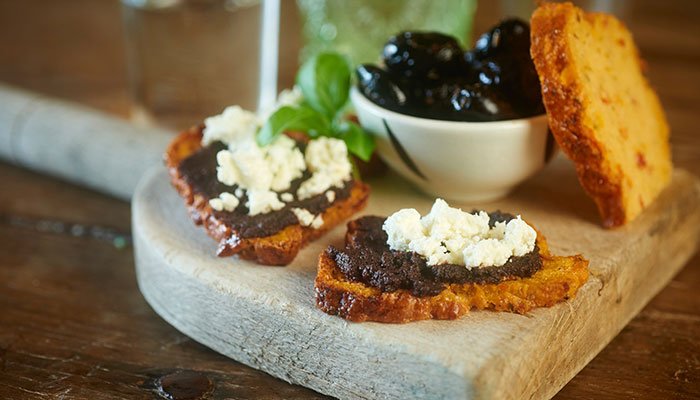Sundried tomato and basil Tartine topped with Black Olive Tapenade and crumbled Feta